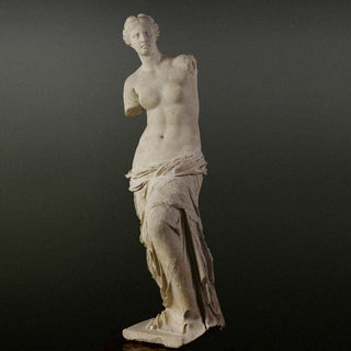 statue of venus on grey background