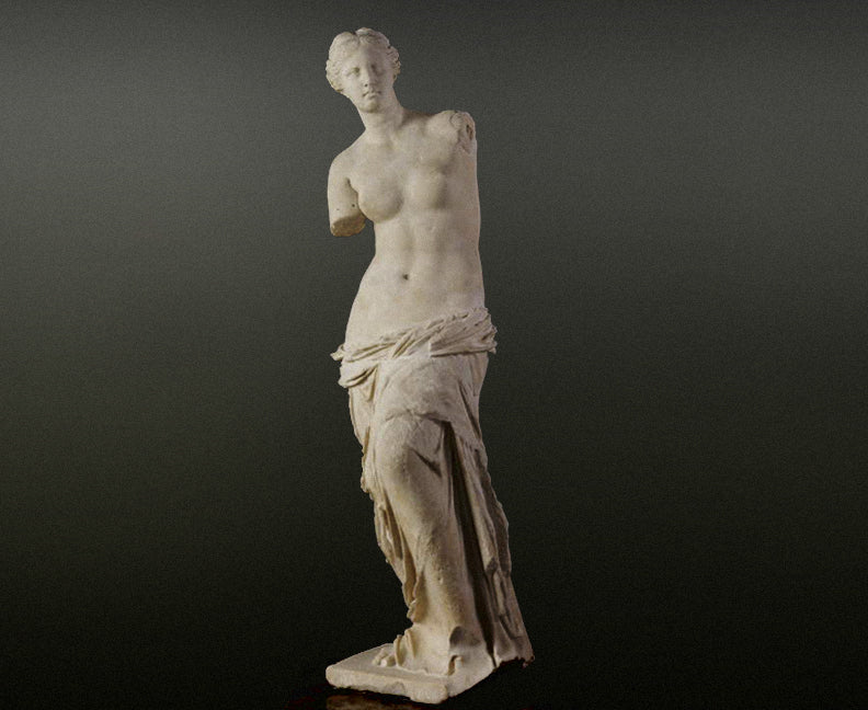 statue of venus on grey background